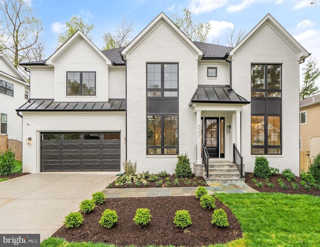 modern inspired farmhouse featuring a garage