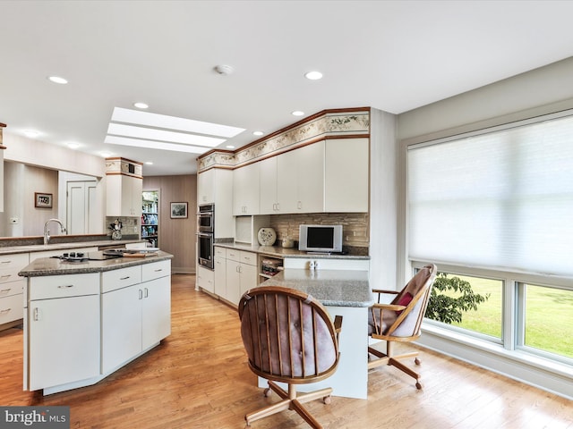 3596 Eagle Dr, Chambersburg, PA 17202 - kitchen featuring a peninsula, decorative backsplash, and double oven