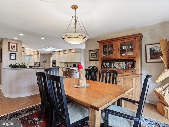 dining space featuring light hardwood / wood-style flooring