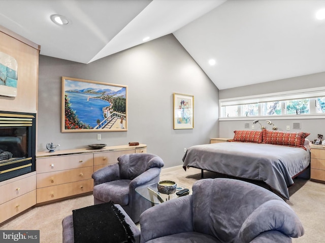 carpeted bedroom with vaulted ceiling