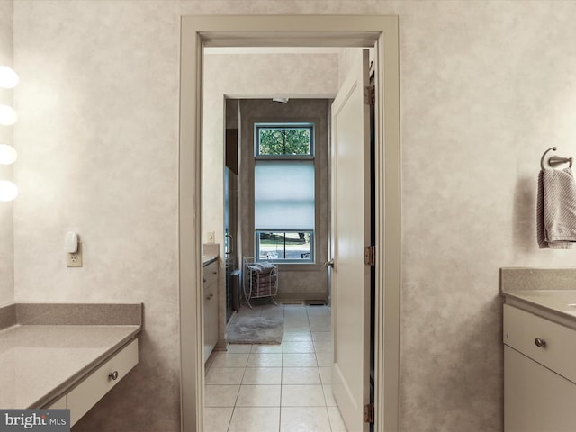 bathroom with vanity and tile patterned flooring