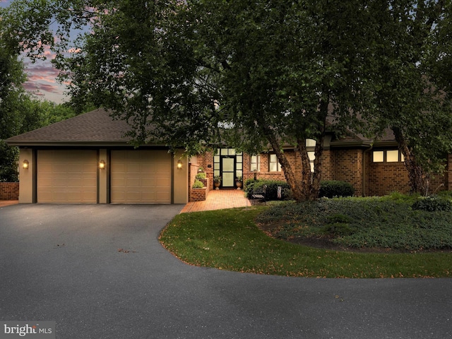 3596 Eagle Dr, Chambersburg, PA 17202 - view of front of property featuring an attached garage, aphalt driveway, and brick siding