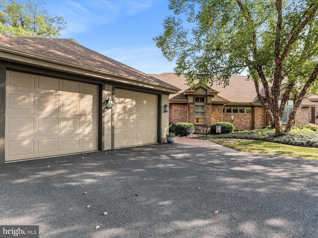 ranch-style house featuring a garage