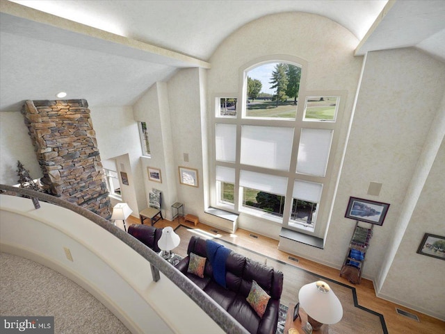 3596 Eagle Dr, Chambersburg, PA 17202 - living area with high vaulted ceiling, visible vents, and wood finished floors
