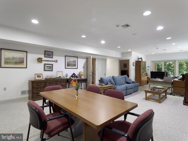 dining room featuring light colored carpet