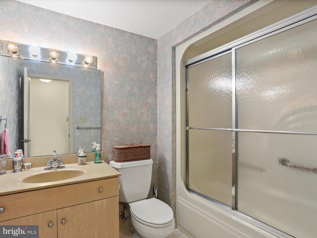 3596 Eagle Dr, Chambersburg, PA 17202 - full bathroom featuring toilet, vanity, shower / bath combination with glass door, and wallpapered walls