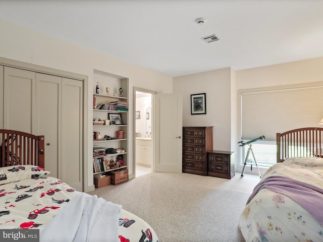 carpeted bedroom featuring a closet