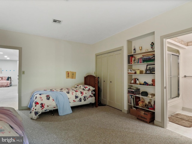 carpeted bedroom with a closet