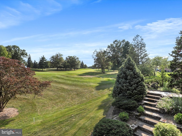 view of home's community featuring a lawn