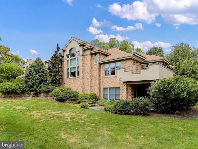 3596 Eagle Dr, Chambersburg, PA 17202 - exterior space featuring roof with shingles, a yard, brick siding, and a balcony