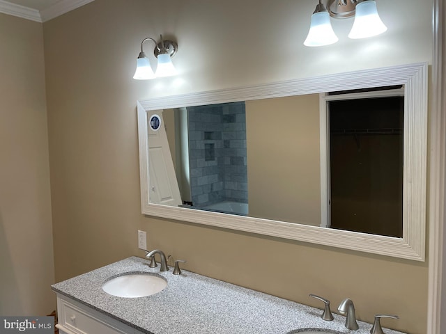 bathroom with ornamental molding and vanity