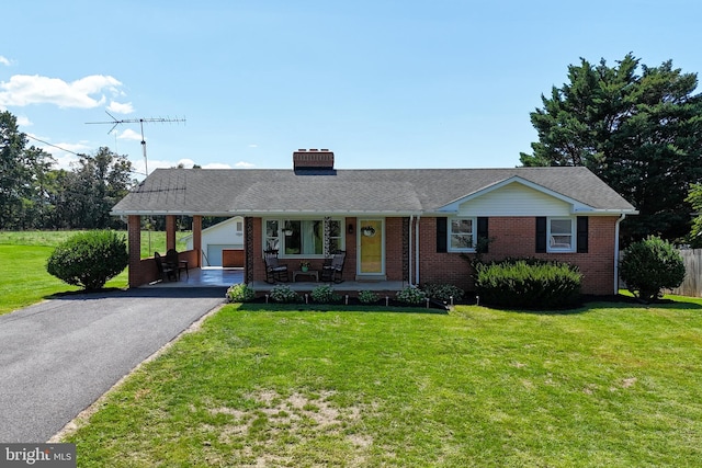 ranch-style home with aphalt driveway, brick siding, a porch, and a front lawn