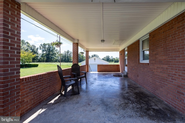 view of patio / terrace featuring an outbuilding