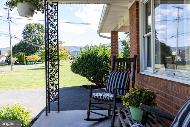 view of patio / terrace with a mountain view