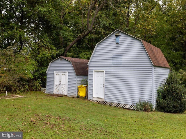 garage featuring a lawn