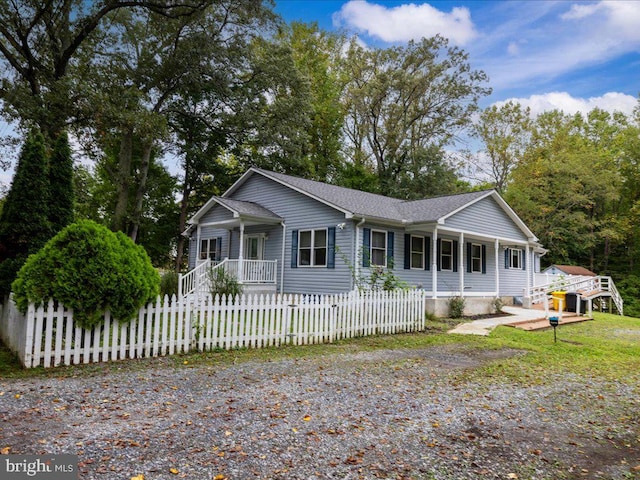 single story home with a porch