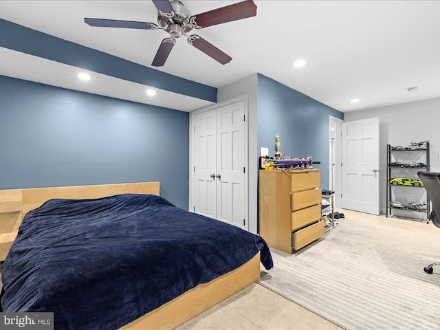 bedroom featuring ceiling fan and a closet