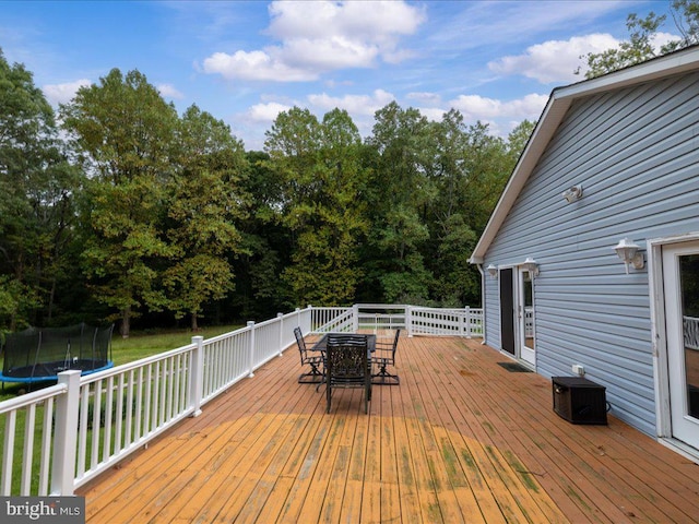 wooden terrace featuring a trampoline