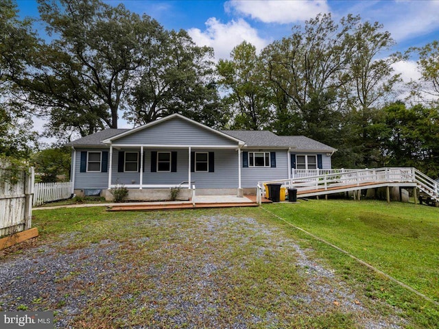 back of house featuring a deck and a yard