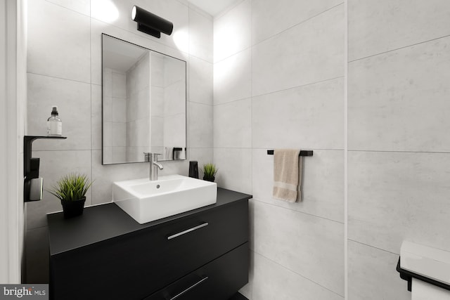 bathroom with tile walls and vanity