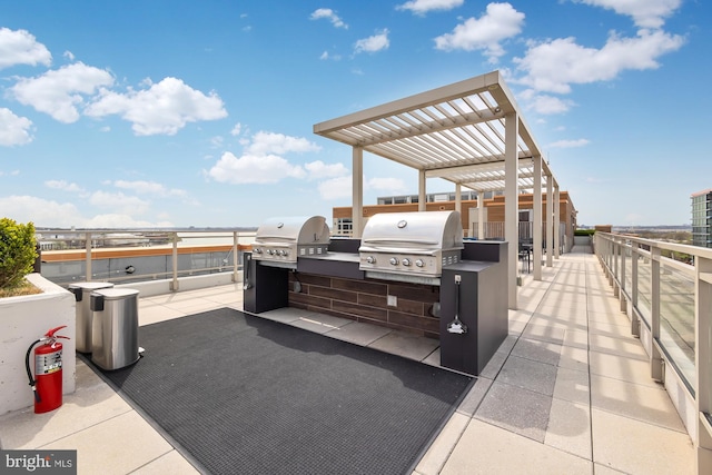 view of patio with a pergola, grilling area, and an outdoor kitchen