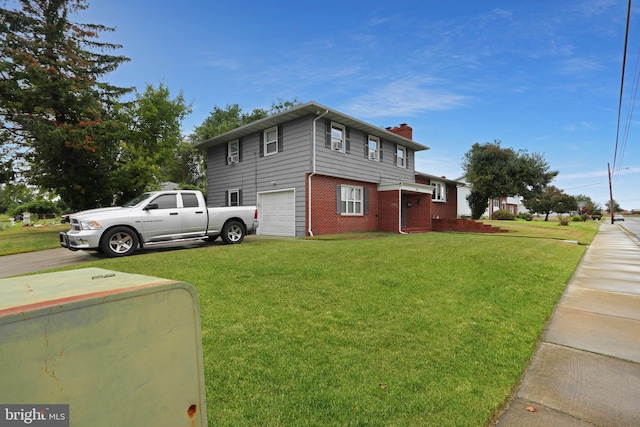 view of front facade featuring a garage and a front yard