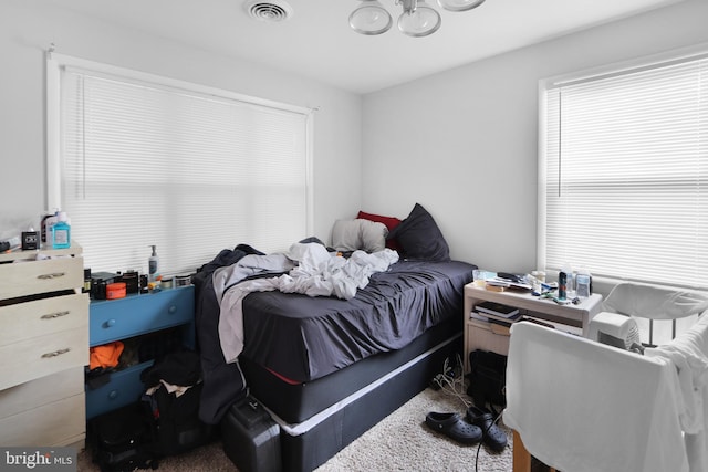 bedroom with dark carpet