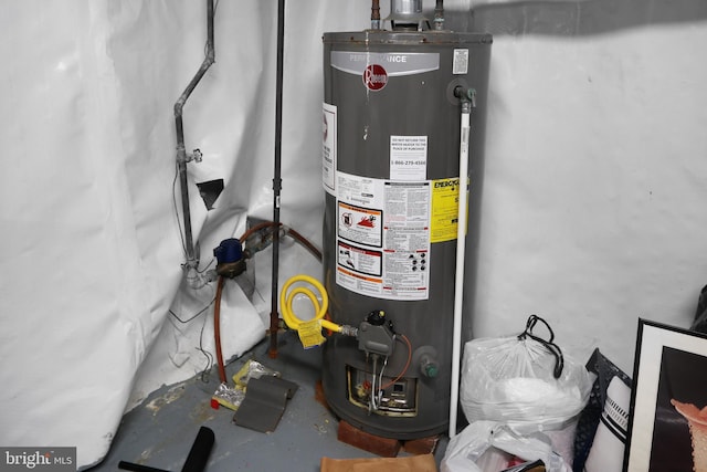 utility room featuring water heater