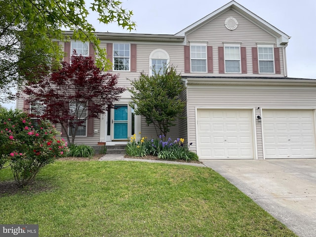 view of front of property with an attached garage, concrete driveway, and a front lawn