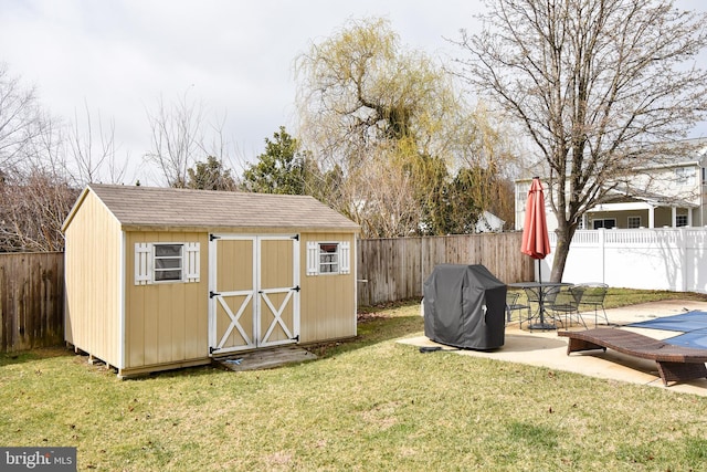 view of shed with a fenced backyard