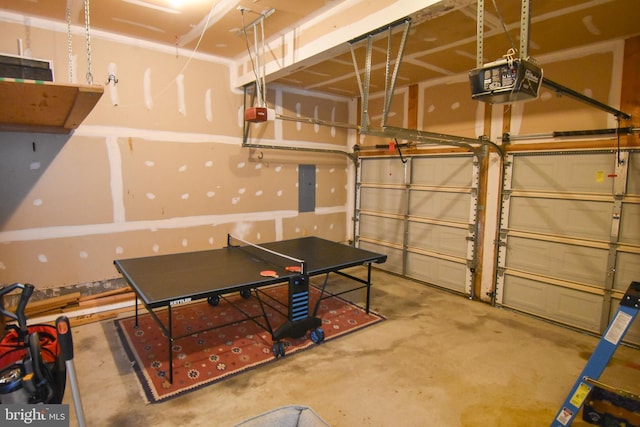 garage featuring a garage door opener and electric panel