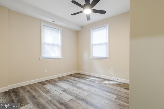 unfurnished room featuring light hardwood / wood-style floors and ceiling fan