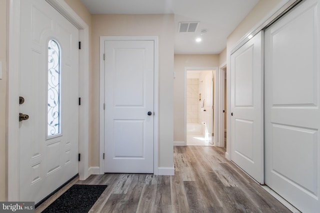 entryway with light hardwood / wood-style floors