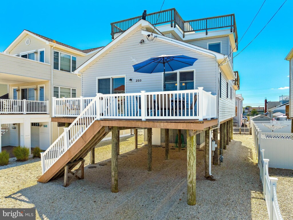 rear view of property with a wooden deck