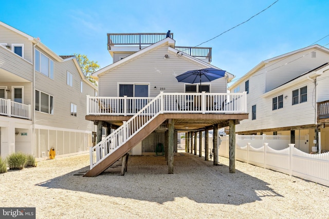 back of house featuring a wooden deck