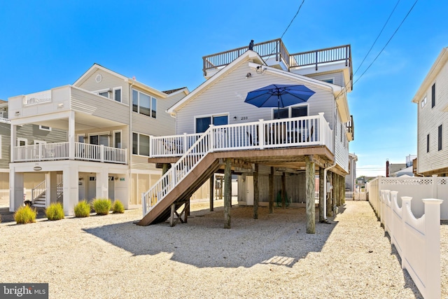 back of property featuring a wooden deck