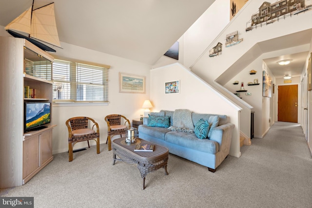 living room featuring light carpet and ceiling fan