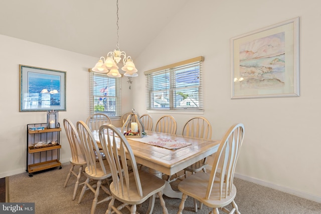 dining space with carpet floors, vaulted ceiling, and an inviting chandelier