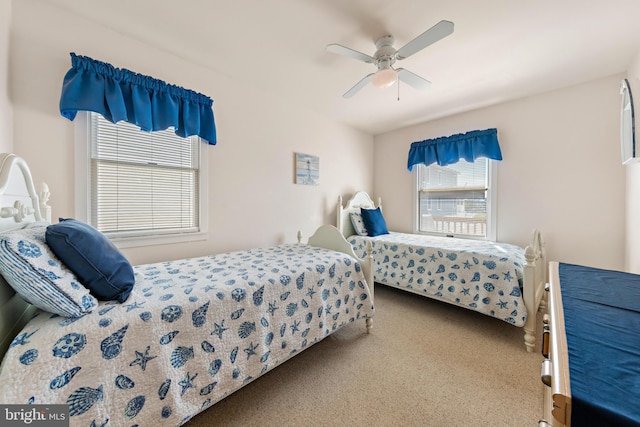 bedroom featuring ceiling fan and carpet flooring