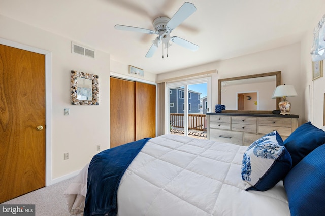 carpeted bedroom with ceiling fan and access to exterior