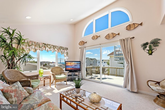 living room featuring carpet flooring and vaulted ceiling