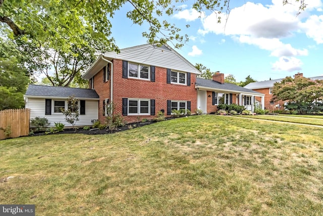 tri-level home with a front yard