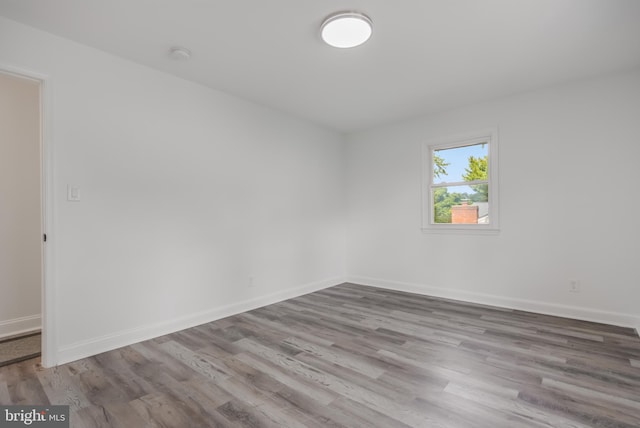 unfurnished room with light hardwood / wood-style flooring