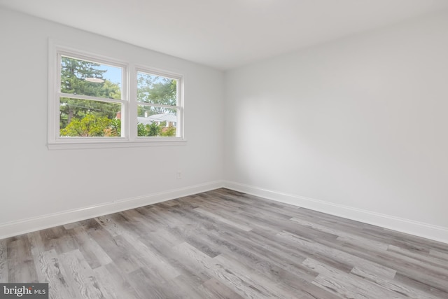 spare room featuring light wood-type flooring