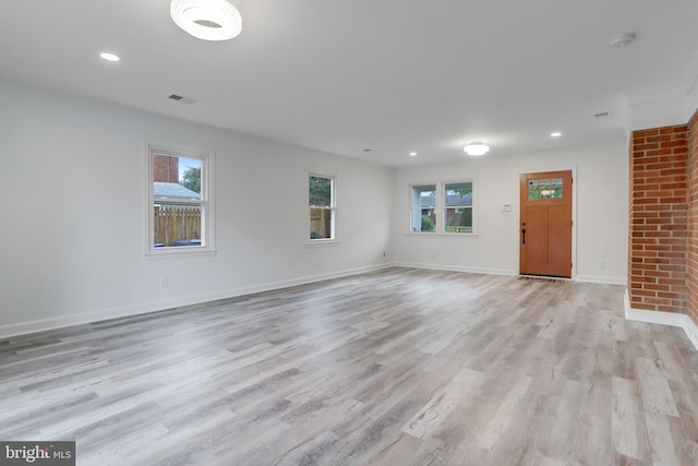 unfurnished living room featuring light hardwood / wood-style flooring