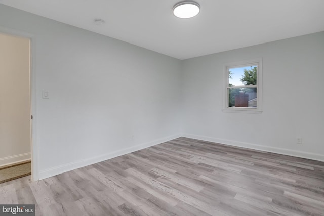 spare room with light hardwood / wood-style flooring