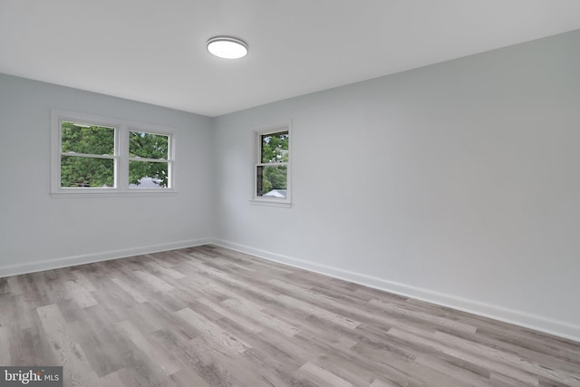 unfurnished room featuring light wood-type flooring