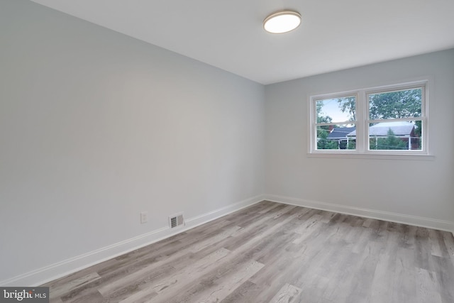 spare room featuring light hardwood / wood-style flooring