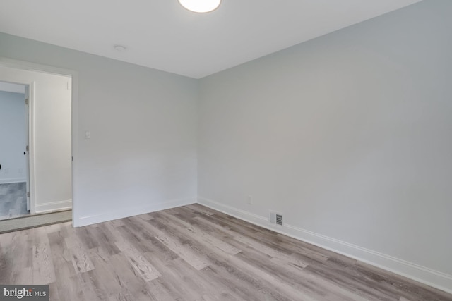 unfurnished room featuring light hardwood / wood-style floors