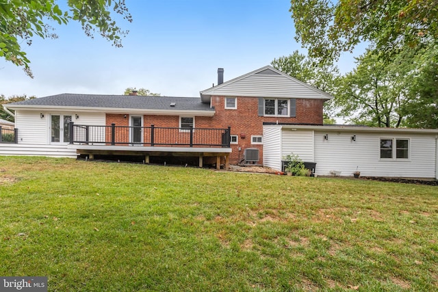 back of house featuring a lawn, cooling unit, and a wooden deck